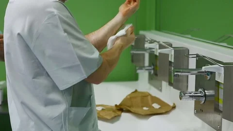Operating. The doctor washes his hands before surgery. Video stock 72501073