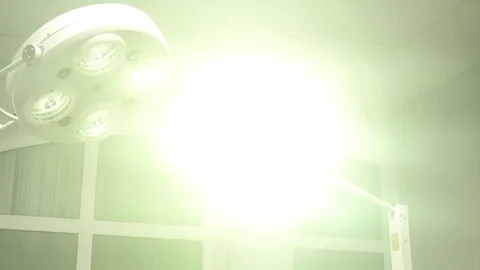 Operating emergency room surgery theater lighting in hospital to enable surgeon Stock Footage 83761544