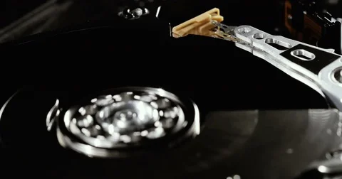 Operating hard disk drive on dark background. HDD reading and writing data. Stock Footage 78792114