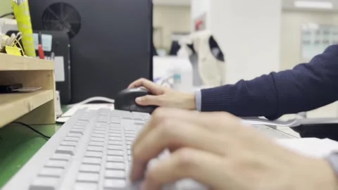 Operating a keyboard and mouse in the office Stock Footage 172230788