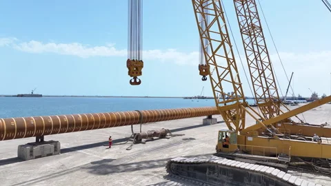 Operating large cranes and pipes on a deepwater rig Stock Footage 280360258
