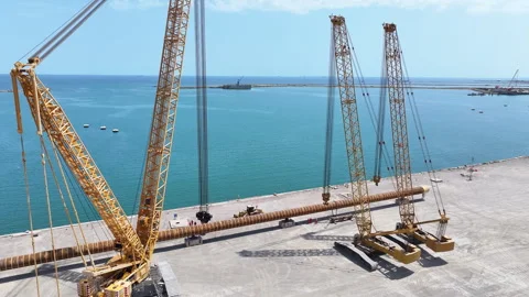 Operating large cranes and pipes on a deepwater rig Stock Footage 280360718