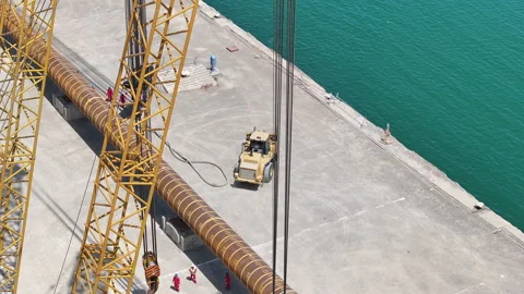 Operating large cranes and pipes on a deepwater rig Stock Footage 280360841
