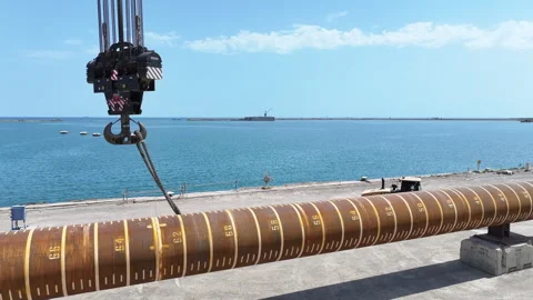 Operating large cranes and pipes on a deepwater rig Stock Footage 280361992