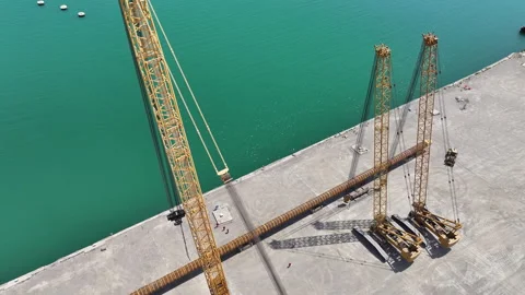 Operating large cranes and pipes on a deepwater rig Stock Footage 280362046