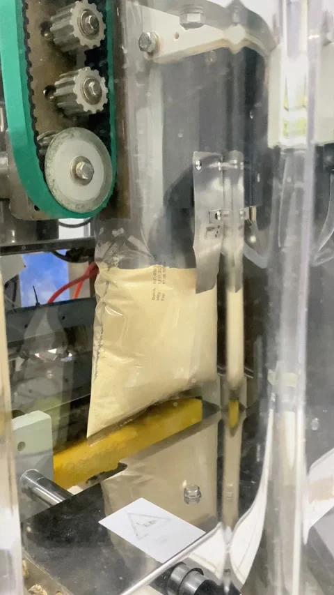 Operating Machine Sealing Process in Industrial Setting Stock Footage 333306779