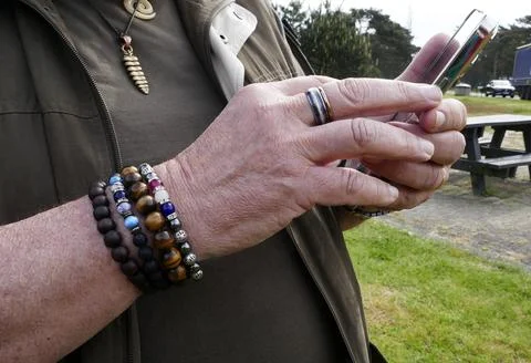 Operating a mobile phone Stock Photos