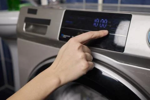 Operating a Modern Washing Machine A Comprehensive Guide to Efficient, User Stock Photos