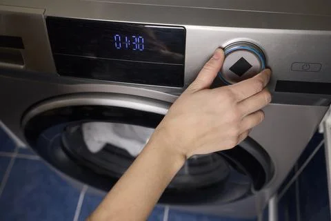 Operating a Modern Washing Machine A Comprehensive Guide to Efficient, User Stock Photos