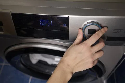 Operating a Modern Washing Machine A Comprehensive Guide to Efficient, User Stock Photos