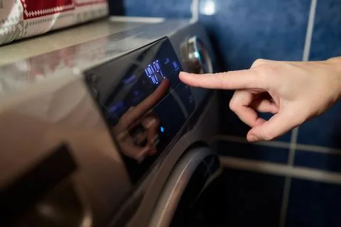 Operating a Modern Washing Machine A Comprehensive Guide to Efficient, User Stock Photos