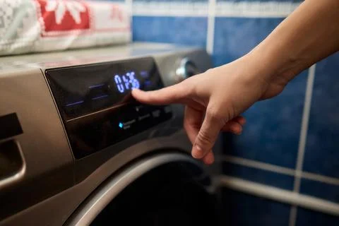 Operating a Modern Washing Machine A Comprehensive Guide to Efficient, User Stock Photos