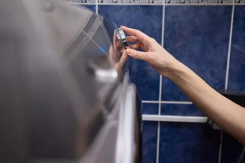 Operating a Modern Washing Machine A Comprehensive Guide to Efficient, User Stock Photos