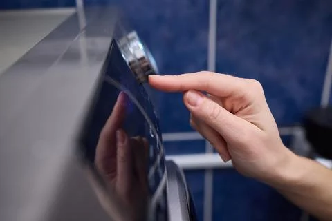 Operating a Modern Washing Machine A Comprehensive Guide to Efficient, User Stock Photos