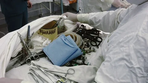 Operating. A nurse prepares the tools for surgery. Stock Footage 77397589