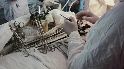 Operating. A nurse prepares the tools for surgery. Stock Footage 77398073