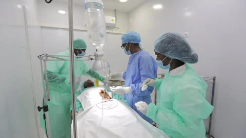 Operating room and team of surgeons, AFRICA Stock Footage 322020219