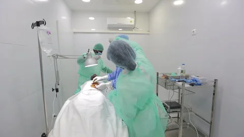 Operating room and team of surgeons, AFRICA Stock Footage 322020224