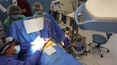 Operating room. Heart surgery. Main doctor surgeon with nurses and medical staff Stock Footage 164961034