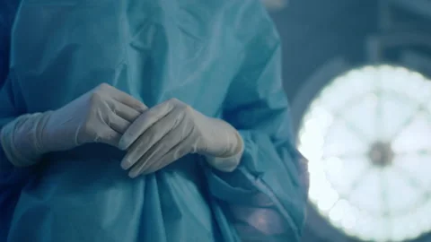 In the operating room at the hospital capturing video details of surgeon man Stock Footage 209974975
