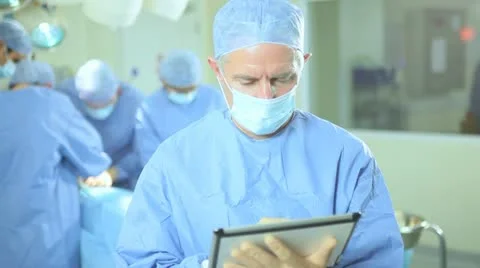 Operating Room Portrait Surgeon Wireless Tablet Foreground Stock Footage 18756695