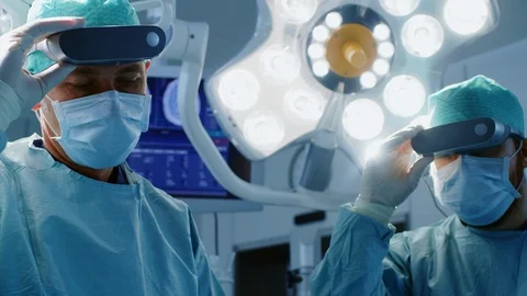 In Operating Room Surgeons Put on VR Glasses Starting Operate Stock Footage 89648239