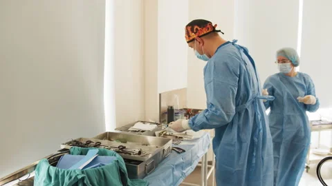 Operating Room of Surgical Table with Instruments, Doctor Picks up Instruments Stock Footage 173164803
