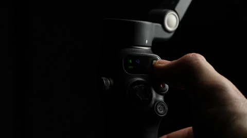 Operating Smartphone Gimbal Control Close Up Stock Footage 329966746