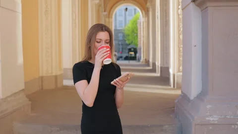 Operating smartphone, Utilizing smartphone, Holding mug Stock-Footage 276865262