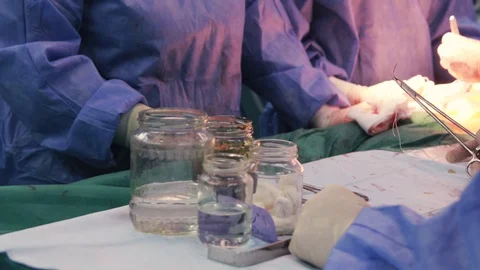 Operating table, banks, doctors Stock Footage 128748048