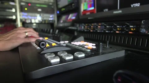 Operating video switcher in broadcasting van Stock Footage 69871996