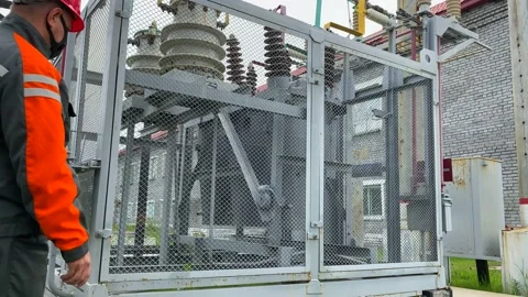 Operation and maintenance of equipment at a distribution substation Stock Footage 136810545