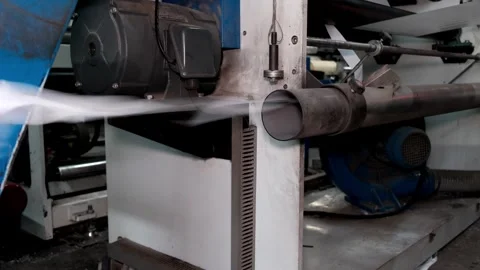 Operation of an automatic plastic bag making machine. White tape of waste d.. Stock Footage 306144049