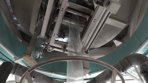 The operation of automatic plastic bag production machine. Video stock 252486005