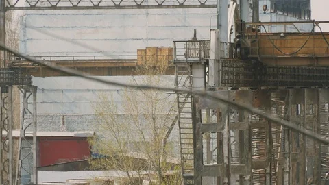 Operation of bridge cranes at the slag processing site at the metallurgical Stock Footage 106925642
