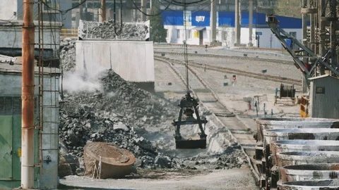 Operation of bridge cranes at the slag processing site at the metallurgical Stock Footage 106925967
