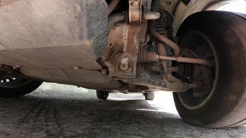The operation of the car suspension in motion. Camera on the bottom of the car Stock Footage 278861297