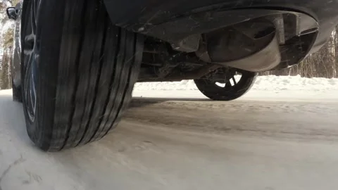 The operation of the car suspension in motion. Camera at the bottom of the car.  動画素材 300116487