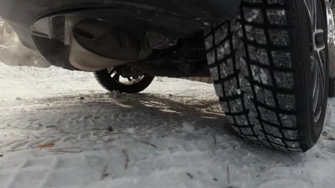 The operation of the car suspension in motion. Camera at the bottom of the car.  Stock Footage 300116514