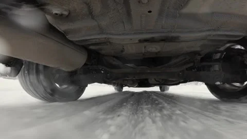 The operation of the car suspension in motion. Camera at the bottom of the car.  動画素材 300116533