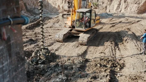 Operation of construction equipment with builders project factory industry Stock Footage 95920014