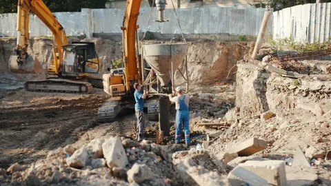 Operation of construction equipment with builders project factory industry Stock Footage 95938292
