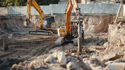 Operation of construction equipment with builders project factory industry Stock Footage 95939076
