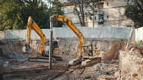 Operation of construction equipment with builders project factory industry Stock Footage 95939188