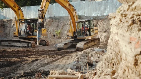 Operation of construction equipment with builders project factory industry Stock Footage 95939489