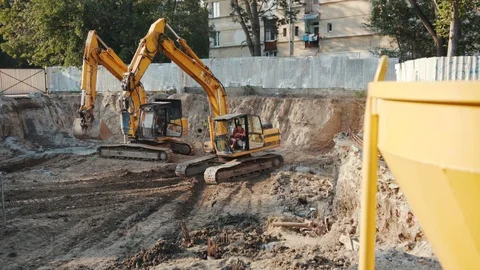 Operation of construction equipment with builders project factory industry Stock Footage 96037203