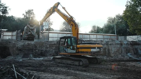 Operation of construction equipment with builders project factory industry Stock Footage 96037338