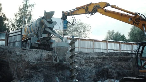 Operation of construction equipment with builders project factory industry Stock Footage 96037416