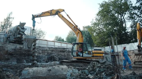 Operation of construction equipment with builders project factory industry Stock Footage 96037610