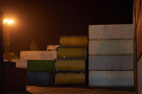 Operation of container terminal at night. Unloading container ship at night.  Stock Photos